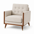 Fauteuil en tissu avec cadre en bois et pieds en laiton