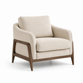 Fauteuil en tissu beige avec structure en bois de hêtre